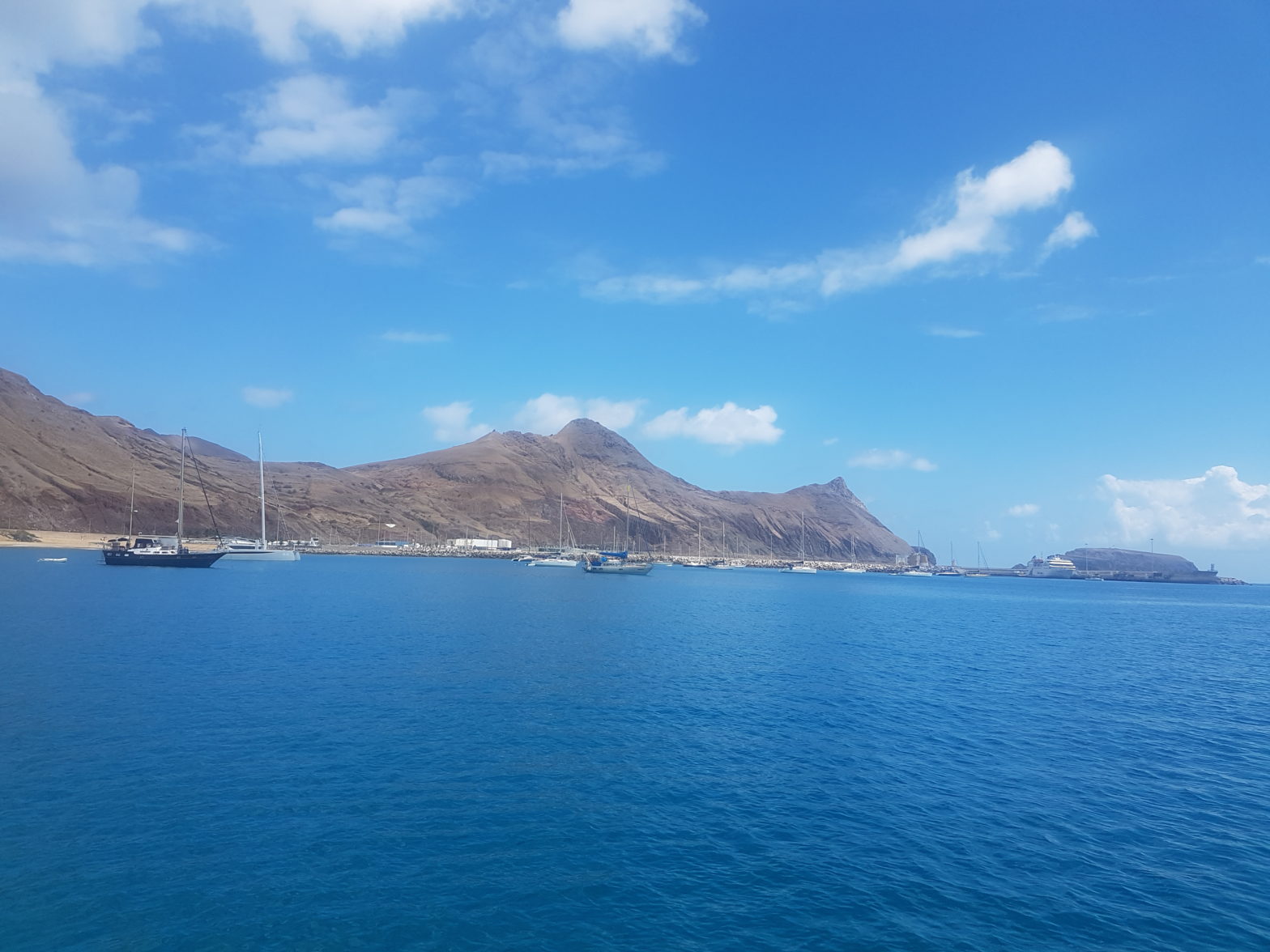 Mountains and sea with boats in Tenerife