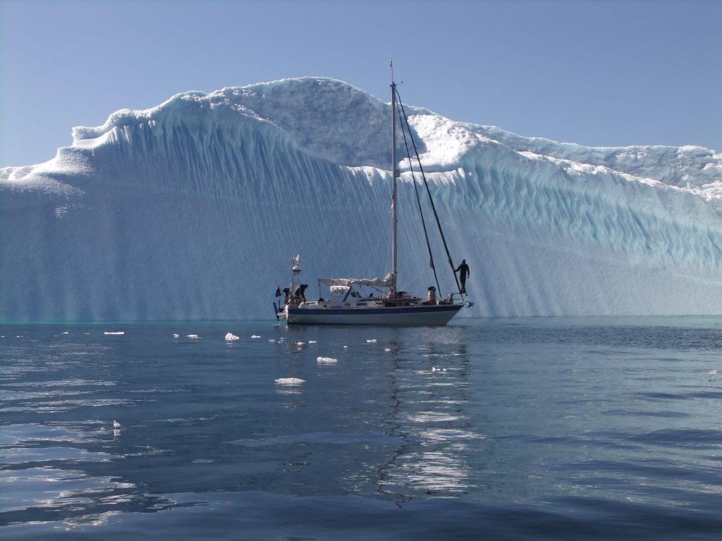 Dodo's Delight anchored in front of an ice shelf